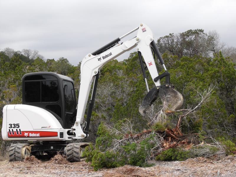 Bobcat 335 excavator clearing cedar